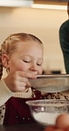 Girl, baking or flour with mom in kitchen for christmas recipe or ingredients together in home. Mother, daughter or teaching junior baker with bowl or sift for mixing, cookies or dessert in house