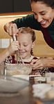 Happy mom, child and whisk with flour in kitchen for baking recipe or ingredients together in home. Mother, daughter and teaching junior baker with bowl for christmas cookies or dessert in house
