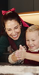 Happy child, mom or clapping hands with flour in kitchen for fun baking or bonding together in home. Mother, daughter and playing with junior baker or smile for christmas cookies or dessert in house