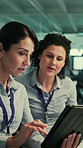 Tablet, discussion and business women in office with research for AI development project. Digital technology, meeting and team of female engineers with planning for computing assignment in workplace.