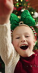 Christmas, face and child in house with open box, gift surprise and thankful in xmas celebration. Bokeh, POV and kid in living room with unboxing, present gratitude and shock in festive season.