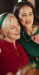 Happy mom, woman or christmas with hug at dinner table for festive feast or celebration in home. Mother, adult or smile with embrace for december holiday, family dining or gathering together in house