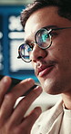 Glasses, phone call and web development with man in office for conversation, feedback or update. Communication, eyewear and reflection with professional developer in workplace for project management