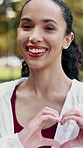 Face, fitness and happy woman outdoor with heart hands, confidence or positive attitude for exercise. Active, female person and love emoji with smile for workout, sports pride or support for wellness