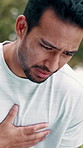 Fitness, man and tired outdoor with chest pain, respiratory problem and hurt from difficult exercise. Active, person and issue with fatigue from intense workout, sports injury or shortness of breath.