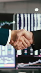 Business people, stock market and handshake with deal for online trading or foreign exchange. Employees, colleagues or brokers shaking hands with meeting for financial partnership, b2b or investment