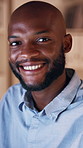 Happy, business and face of black man at night for working on deadline, proposal and finance report. Portrait, professional and person with confidence, pride and smile for financial advisor career