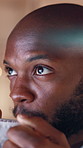 Coffee, reading and black man in office at night with research for international investment growth. Cappuccino, bokeh and African financial manager drinking warm beverage for finance report deadline.