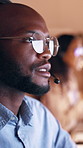 Call center, glasses or man in office with headset, contact us or crm service in evening. Tech, coworking or consultant in agency with mic, online communication or customer support in overtime.