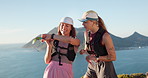 Hiking, friends and people with smart watch on mountain, check step counter and journey time discussion. Ocean, trekking adventure and happy women with tech to track distance, talk and drinking water