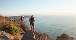 Fitness, running and friends with sunglasses on mountain, cliff trail and workout for endurance training. Sunset, active and women with jog for exercise, shades and cardio challenge by sea together