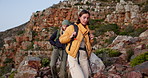 Friends, hiking and outdoor on mountain with backpack, conversation and bonding together for trip. Women, walk and trekking journey in nature with bag, discussion or tourist exploration for adventure