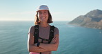 Fitness, hiking and face of woman in nature by ocean for discovery, adventure or exercise on holiday. Travel, happy and portrait of female person outdoor for trekking by sea for active on vacation.