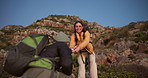 Hiking, women and helping hands on mountain for support, backpacking and adventure with partner. Trekking, travel and people with assistance for climbing, smile and teamwork with friends outdoor