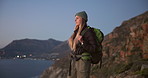 Serious, thinking and woman hiking on mountain for travel, adventure and reflection. Space, female person and vision with evening scenery, backpacking view and trekking fitness for sightseeing nature