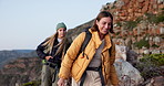 Friends, hiking and smile on mountain with backpack, conversation and bonding together for adventure. Women, trekking journey or outdoor in nature with bag, discussion or tourist exploration for trip