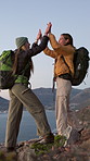 Women, hiking and high five on mountain with hug, sea view or achievement for backpacking adventure. Friends, embrace or celebration on cliff with ocean scenery, bonding or success for trekking trip.