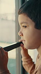 Lonely, thinking and sad with child at window in home for memory, abandoned and foster trauma. Grief, reflection and separation anxiety with boy in apartment for worry, fear and psychology crisis