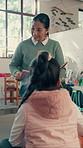 Woman, teacher and reading book with children in classroom with talk, literature or explain at school. Person, kids and storytelling for education, learning and smile with development at academy