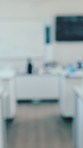 Empty, tables and science in classroom at school for research, chemistry and learning workstation. Blurred, interior and equipment for education, medical knowledge and lab for chemical experiment 