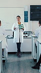 Talking, students or teacher with molecule for education, science class or chemical compound knowledge. Research lab, teaching or Asian woman with particle structure lesson, medical info or learning