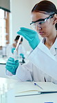 University, chemistry and woman with test tubes for experiment, notes and research project. Students, microbiology and education with notebook, classroom and laboratory with scholarship and pathology