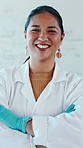 Crossed arms, woman and face of scientist in laboratory with confidence for science career. Smile, professional and portrait of Asian female person with pride for medical biology job with about us.