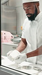 Black man, chef and knead with dough at restaurant for cuisine, dessert or ingredients in kitchen. African person, baker and flour for food, preparation and pastry production for order at diner
