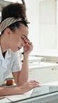 Woman, headache and laptop at bakery in kitchen, stress or inventory management with pain at restaurant. Person, small business owner and chef with computer, migraine and typing for stock at diner