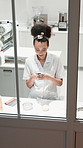 Woman, chef and phone with texting in restaurant kitchen on break, above and smile for web post. Person, cook and happy on smartphone, mobile app and scroll on social network with culinary career