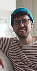 Home, smile and man on couch, conversation and bonding together in living room. Apartment, relax and happy people on sofa, laughing and gossip for funny story, weekend break and communication