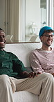 Happy men, friends or watching tv with laugh on sofa for funny joke, comedy show or movie. Male people, humor or relax with smile on living room couch for entertainment or online subscription in home