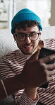 Cellphone, relax and friends on sofa in home for reading funny blog, social media post or texting. Happy, technology and male people with phone for networking on mobile app in living room at house.