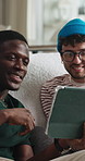 Tablet, happy and friends on sofa in home for reading funny blog, social media post or texting. Relax, digital technology and male people with smile for networking on app in living room at apartment.