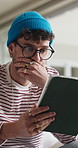 Shock, tablet and man on sofa in home with communication, social media or reading blog. Digital technology, bad news and male person in living room for texting on app for contact in apartment.