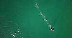 Drone, speed and travel with boat on ocean for adventure, transportation or water sports. Aerial, space and nature with sea vehicle outdoor in summer for holiday, journey or vacation from above