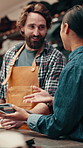 Speaking, people and fabric sample in warehouse, leather manufacturing and writing for material choice. Textile production, talking and worker with woman in factory, cloth order and decision notes