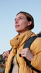 Breathing, backpacking and woman on mountain for outdoor hiking, adventure or fitness on holiday. Travel, journey and female person trekking for exercise, hobby or health on vacation or weekend trip.