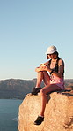 Hiking, relax and woman with fitness, smartphone and adventure with sunshine, wellness and holiday. Outdoor, hiker and person with summer break, cellphone and trekking for health benefits and typing