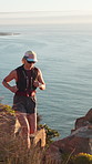 Hiking, fitness and woman in nature, ocean and cardio workout for health benefits. Outdoor, hiker and person with routine, adventure and environment with vacation, running and support for exercise