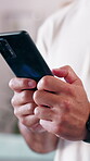 Typing, hands and person with phone in home, weekend entertainment and connection for gaming website. Internet, digital app and man with mobile game for virtual world, playing and online competition
