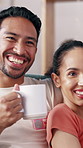 Laugh, talking and couple on sofa with drink for bonding, funny series and watching tv together. Home, dating and man with woman on couch with beverage for streaming, entertainment and conversation