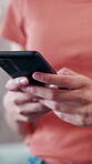 Typing, hands and woman with phone in home, browsing internet and check social media app on weekend. Texting, message notification or person with mobile for communication, chat response or networking