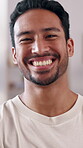 Happiness, face and man in home with arms crossed, positive attitude or good mood on break. Satisfaction, confidence and Asian person in portrait with smile, wellness or optimism on day off at house