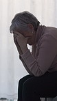 Sad, crying and senior woman in home, anxiety and mourning for grief, loss and contemplation. Remember, stress and person with depression, mental health or retirement with reaction, lonely or emotion