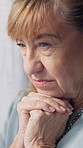 Sad, thinking and senior woman in home, anxiety and mourning for grief, loss and alzheimer. Reflection, stress and elderly person with depression, mental health or retirement with reaction and memory