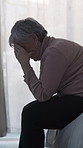 Sad, stress and senior woman in home, anxiety and mourning for grief, loss and contemplation. Remember, tired and person with depression, mental health or retirement with reaction and alzheimer