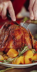Hands, cut and roast chicken in house with dinner, traditional meal and cuisine for Christmas holiday. Person, slice meat and food in home with knife, supper and healthy nutrition for festive season.