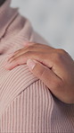 Hand, comfort and nurse with woman in home for consultation, medical support or healthcare. Advice, compassion and caregiver touching shoulder of female patient for trust in nursing facility.