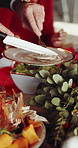 Hands, cutting and roast chicken in home with Christmas dinner, traditional meal and cuisine for family. People, meat food and serving in house for festive season, social gathering and xmas holiday.